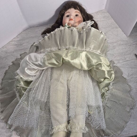 Heirloom Treasure Doll, Dark Long Curley Hair with Green Dress and Bow on Front - Picture 6 of 10